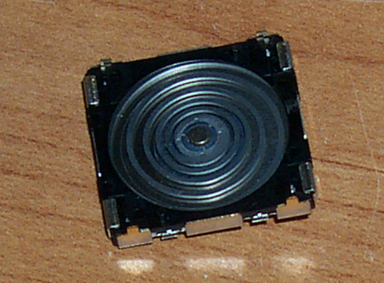 Figure 3: The joystick's self-centering action relies on a precision spiral spring.
